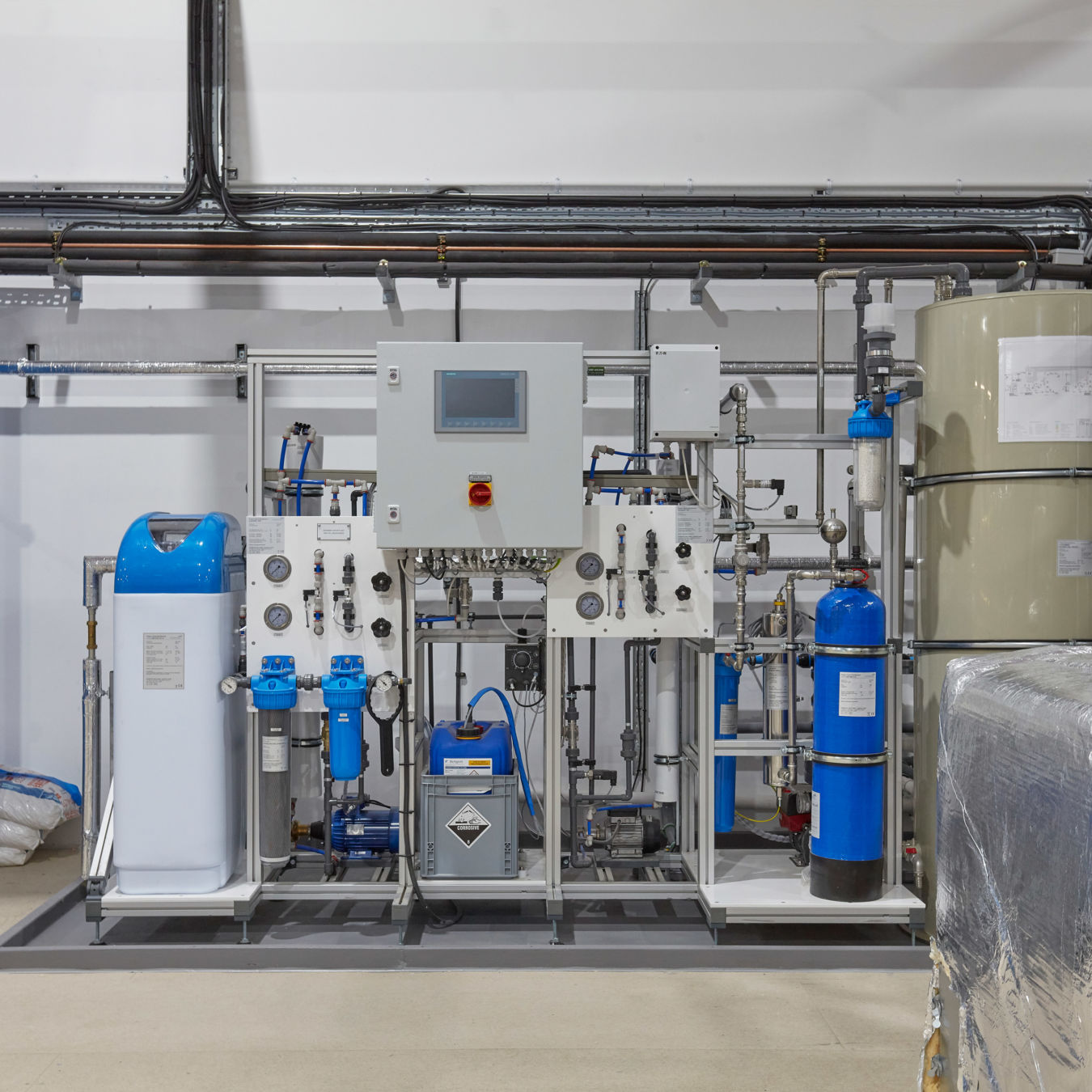 Laboratory utility system featuring blue water treatment and filtration units, installed as part of a COEL lab infrastructure project for Sense Bio.