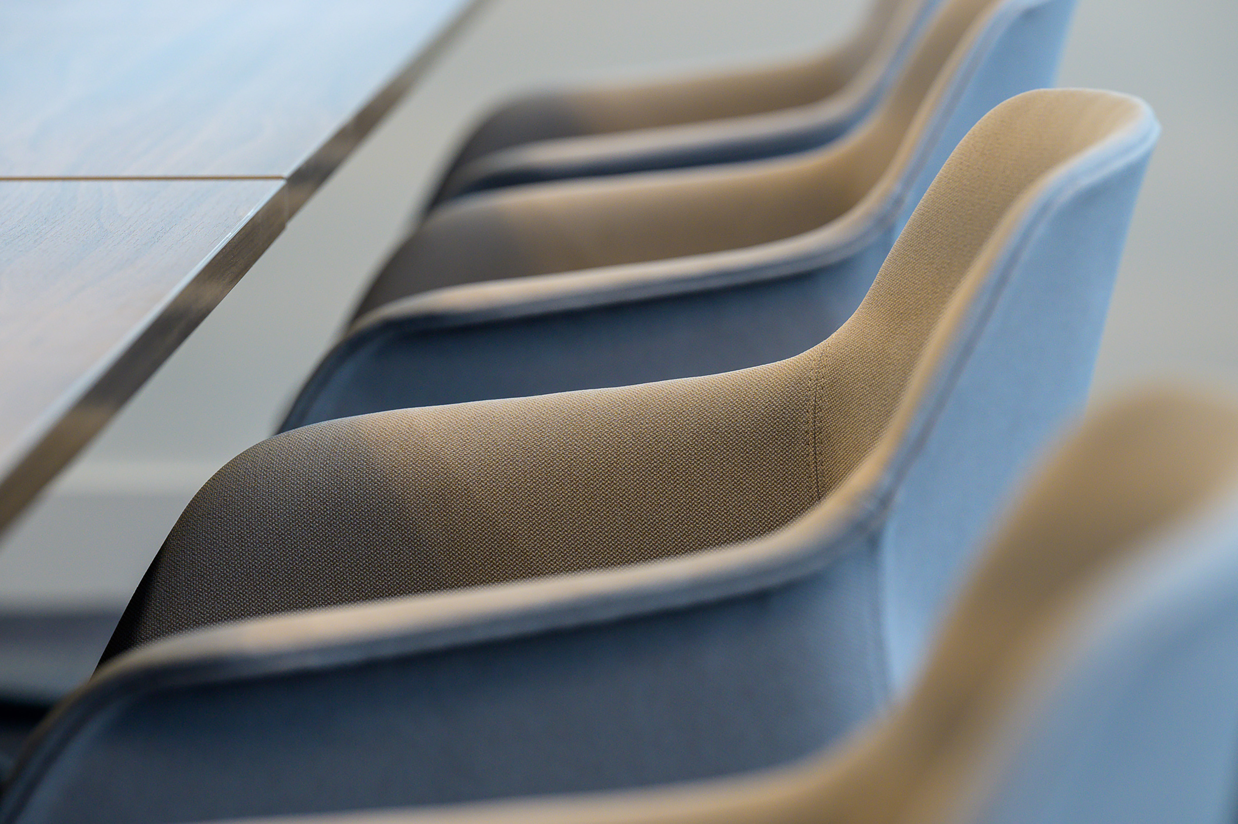 Close-up of upholstered meeting chairs and a boardroom table, part of a COEL office furniture installation for BioMed Realty.