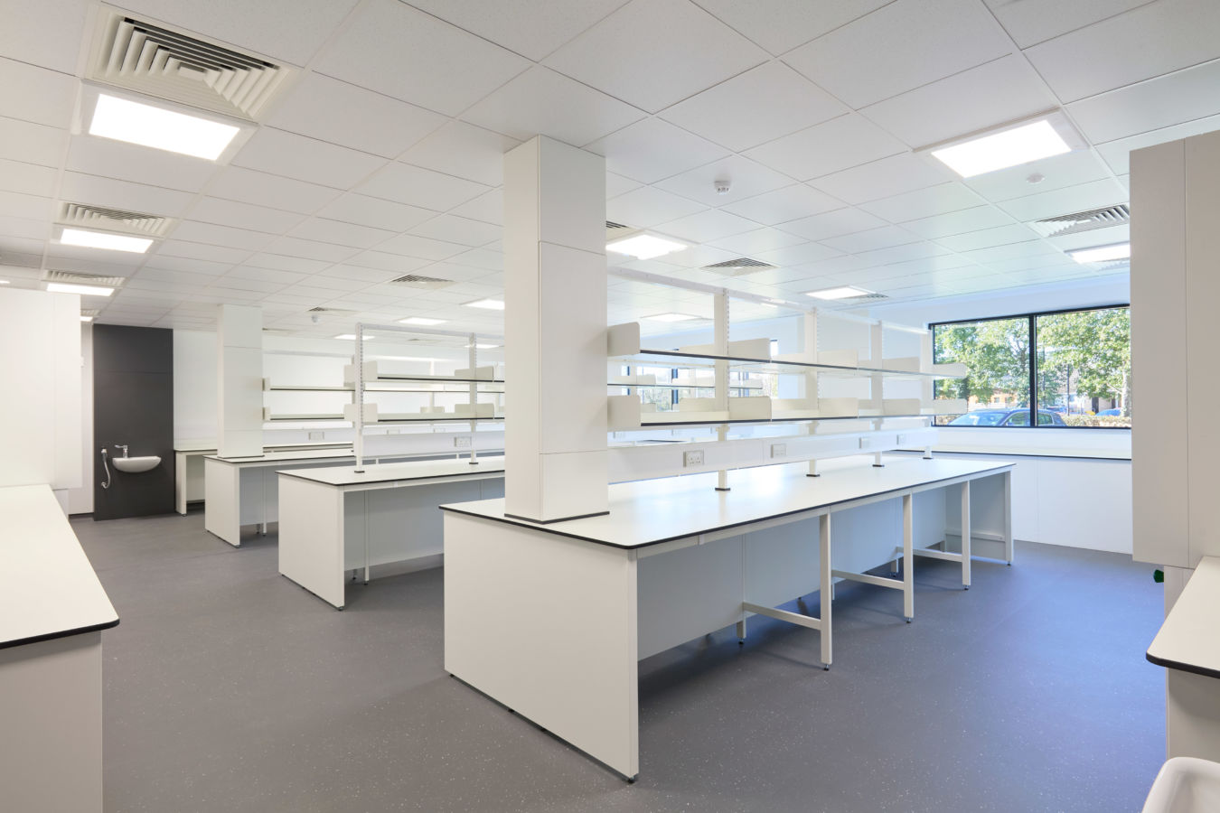 laboratory featuring rows of white benches