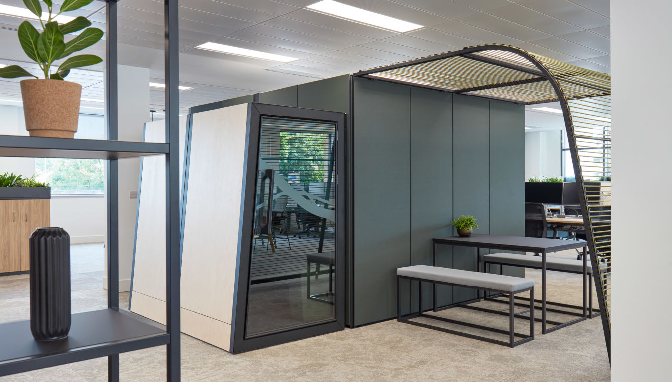 Modern breakout area with enclosed meeting pod and bench seating, designed and installed by COEL for Agile Analog.