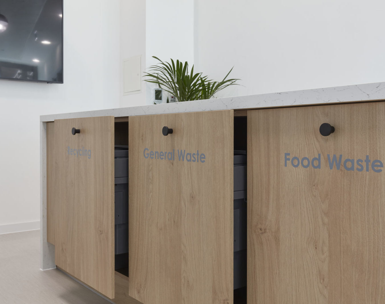 Image of labelled recycling wins to separate waste